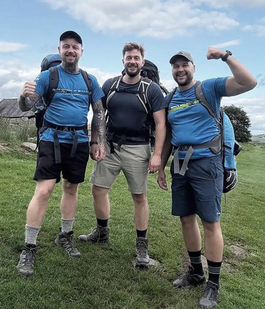 Group of men celebrating hike