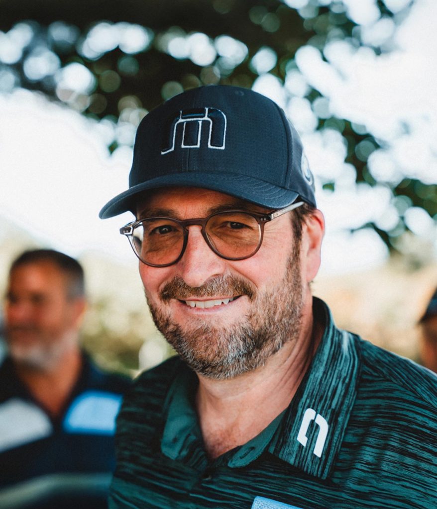 Man in baseball cap smiling
