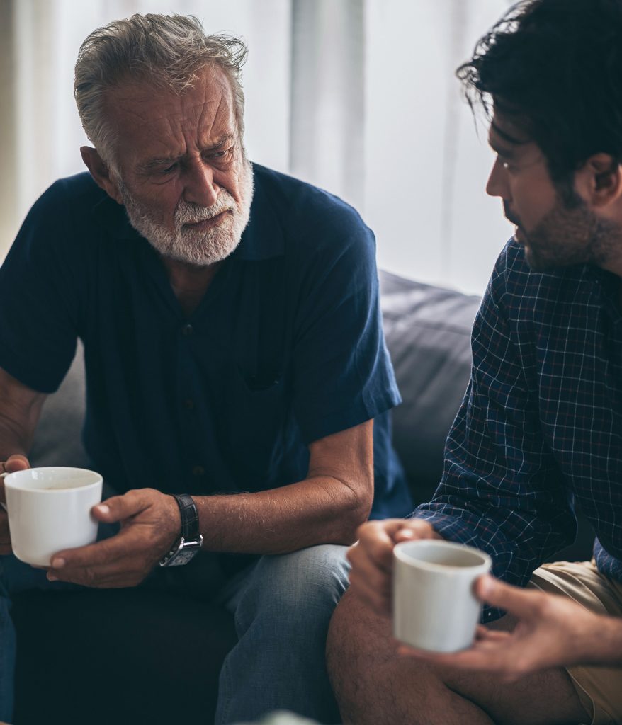 man chatting over coffee